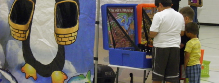 Penguin game backdrop with children playing