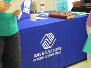 People at the registration area for Boys and Girls Clubs of North Central Texas